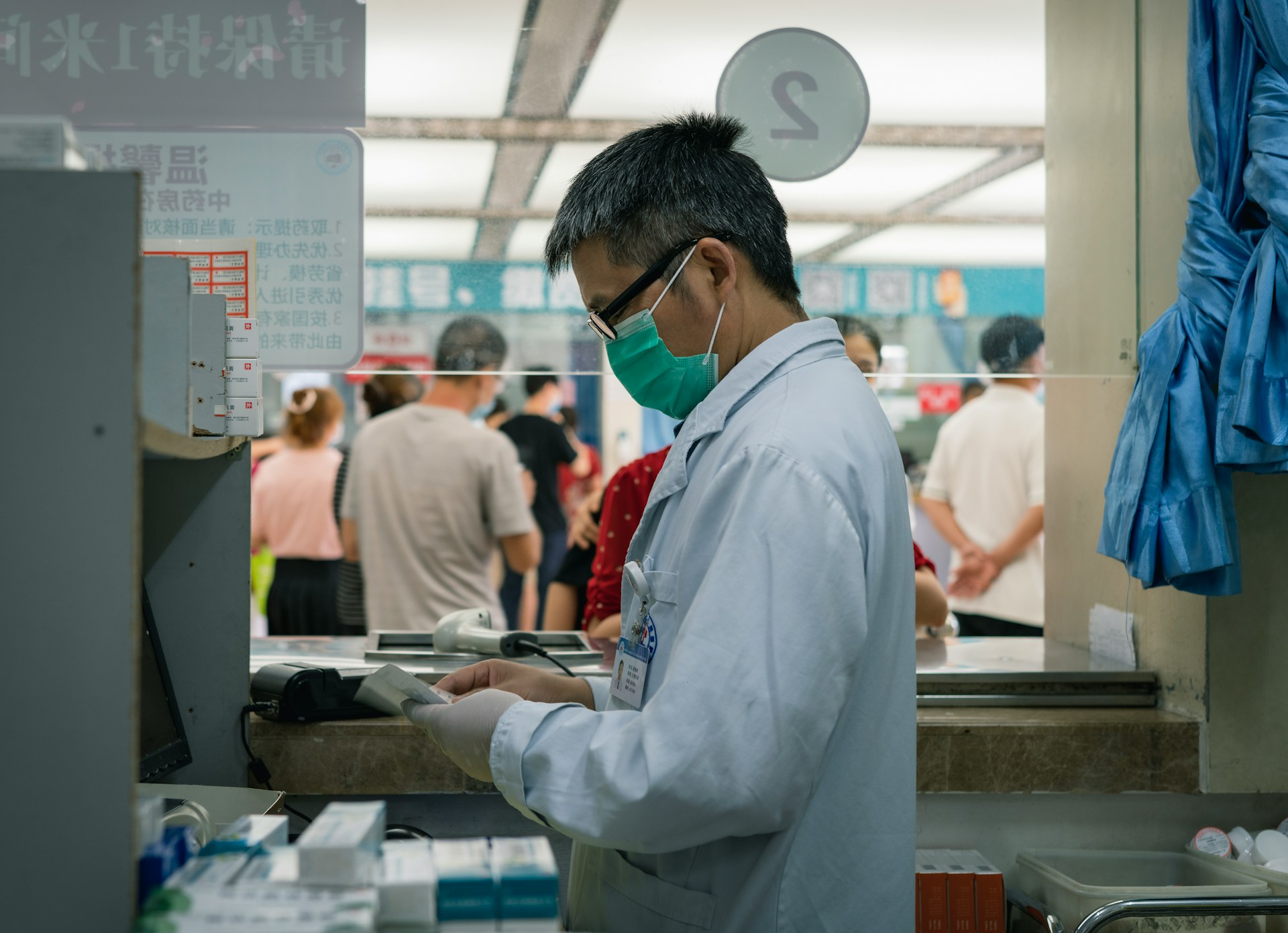 doctor standing in front of a table